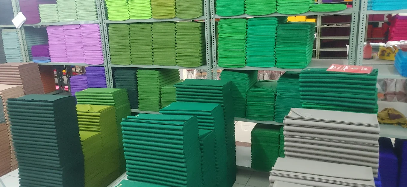 Rack of folded lining fabric in a wholesale warehouse